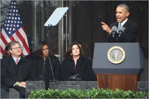 President Obama spoke feelingly about the late Sen. Ted Kennedy at the dedication of the Edward M. Kennedy Institute for the United States Senate on Columbia Point, Dorchester, on Mon., March 30.  Seated at left, Edward M. Kennedy Jr., First Lady Michelle Obama, and the senator’s widow, Victoria Kennedy. Chris Lovett photo